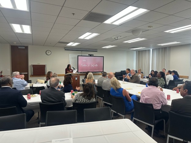 image of president Neidy Pinuelas speaking to attendees