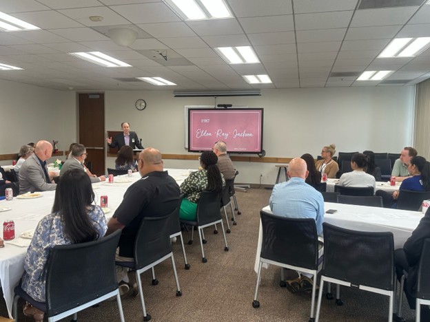 image of past president bill larsen speaking to attendes